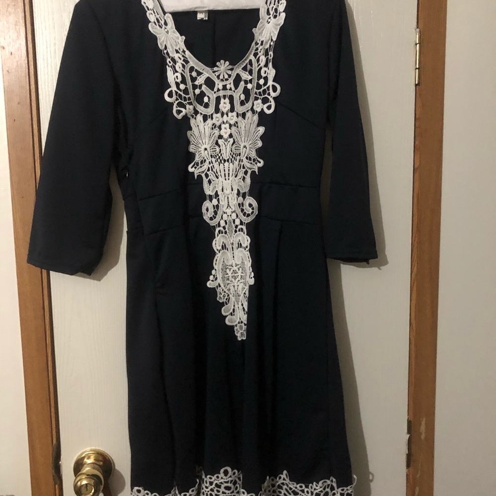 Navy blue dress with white lace trim